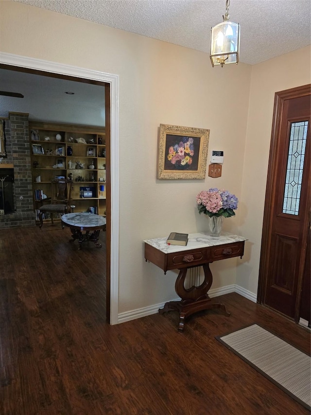 3810 Lucena Ct, Grand Prairie, TX 75052 - foyer entrance with wood finished floors and a textured ceiling