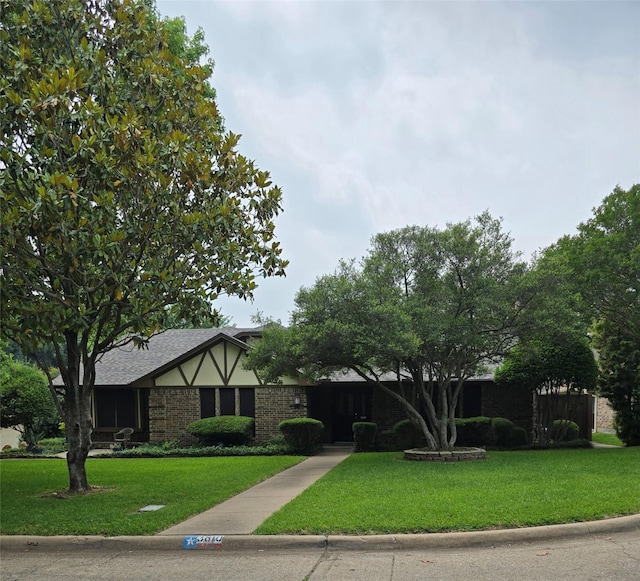 3810 Lucena Ct, Grand Prairie, TX 75052 - english style home featuring a front lawn