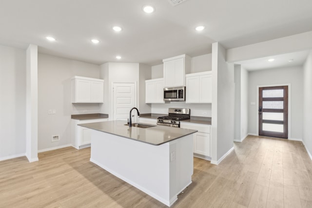 535 Forest Hvn, Van Alstyne, TX 75495 - kitchen featuring stainless steel appliances, light wood-style flooring, white cabinetry, and recessed lighting