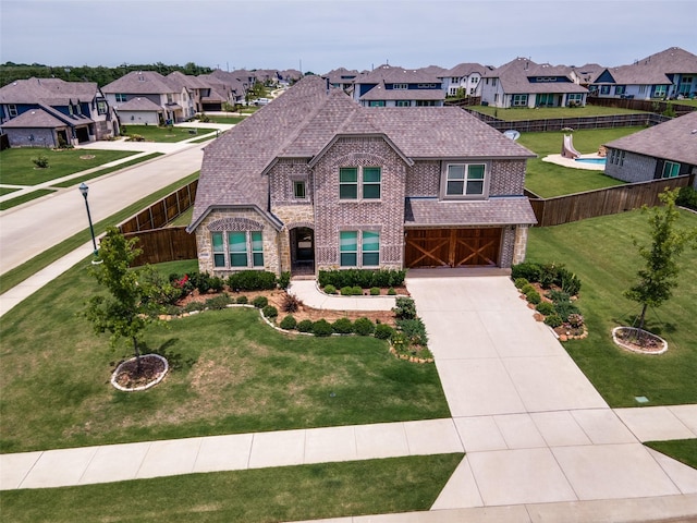 11100 Tanager Ln, Cross Roads, TX 76227 - view of front of house featuring a residential view, brick siding, concrete driveway, a garage, and roof with shingles