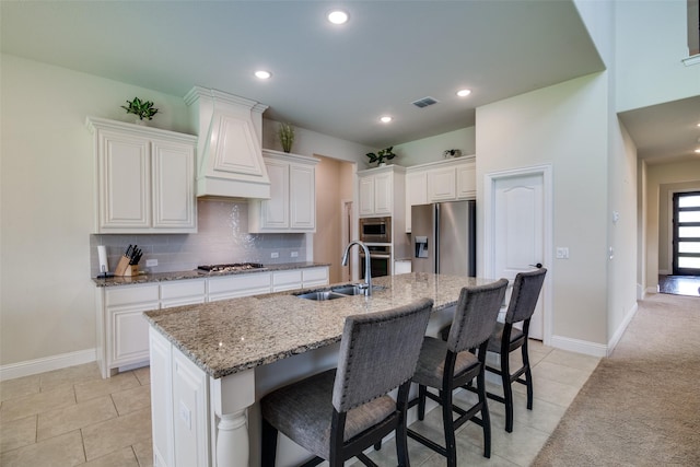 11100 Tanager Ln, Cross Roads, TX 76227 - kitchen with stainless steel appliances, light tile patterned floors, white cabinetry, light stone counters, and recessed lighting
