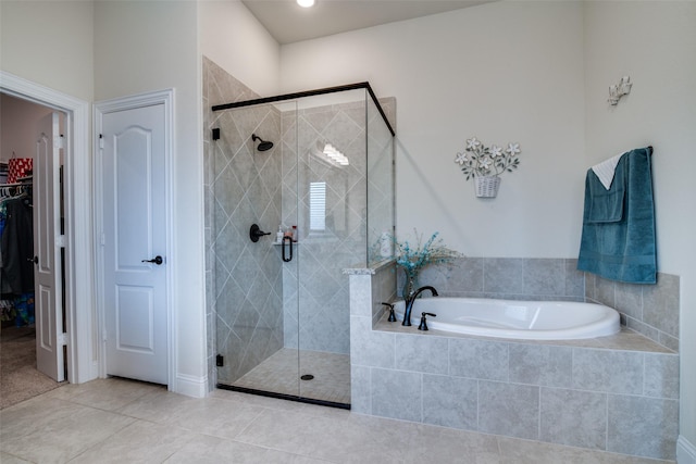 11100 Tanager Ln, Cross Roads, TX 76227 - full bath featuring a garden tub, a stall shower, tile patterned flooring, and a walk in closet