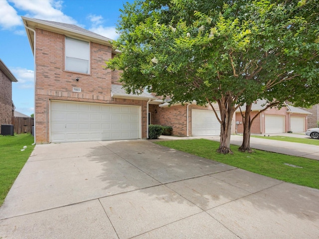 5813 Blackmon Ct, Fort Worth, TX 76137 - view of front of property with brick siding, driveway, and a garage