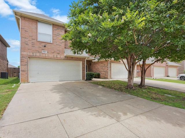 5813 Blackmon Ct, Fort Worth, TX 76137 - view of front facade with brick siding, an attached garage, and concrete driveway