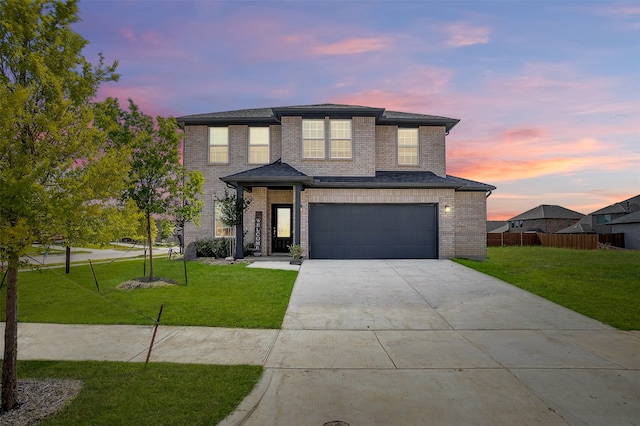 7501 Agarita Ave, Denton, TX 76226 - view of front of home featuring driveway, an attached garage, and brick siding