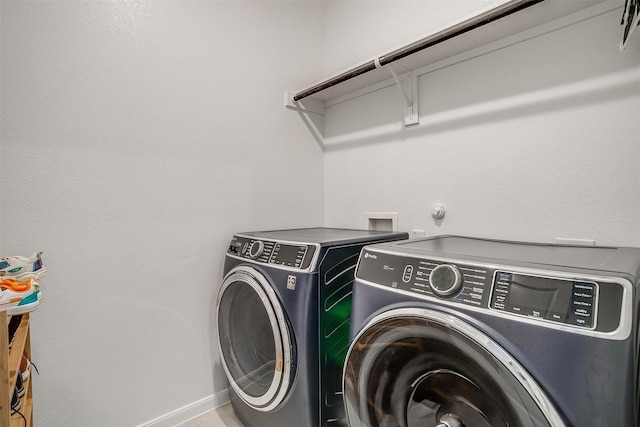 7501 Agarita Ave, Denton, TX 76226 - laundry area with washing machine and clothes dryer and baseboards