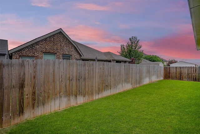 7501 Agarita Ave, Denton, TX 76226 - yard at dusk featuring a fenced backyard