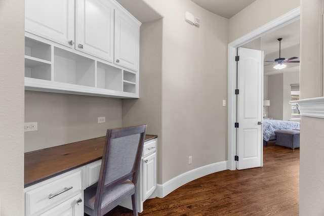1707 Ponderosa Trl, Sachse, TX 75048 - unfurnished office with dark wood finished floors, a ceiling fan, and built in study area