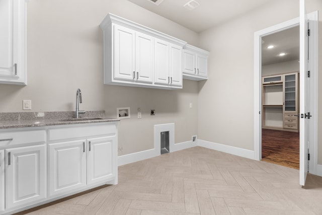 1707 Ponderosa Trl, Sachse, TX 75048 - laundry area featuring hookup for a washing machine, cabinet space, hookup for an electric dryer, gas dryer hookup, and recessed lighting