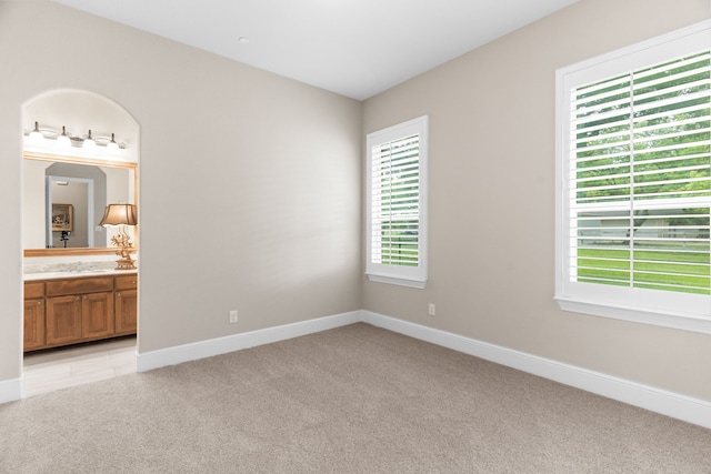 1707 Ponderosa Trl, Sachse, TX 75048 - unfurnished bedroom with light colored carpet and connected bathroom