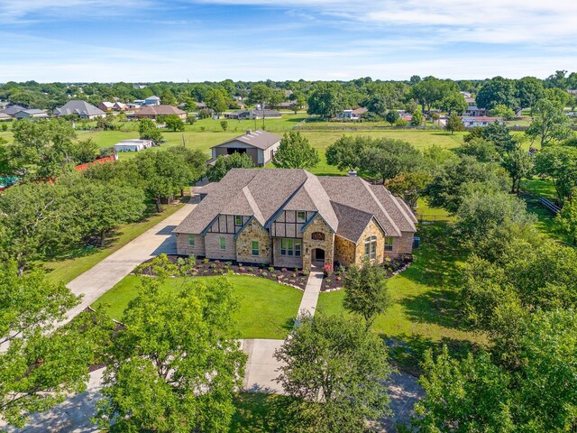 1707 Ponderosa Trl, Sachse, TX 75048 - view of subject property featuring a tree filled landscape