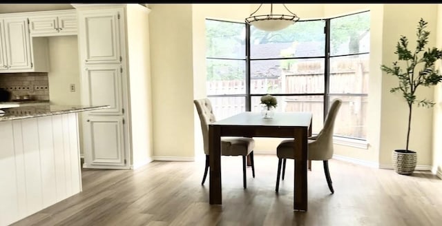 5016 Kemble St, Fort Worth, TX 76103 - dining area with wood finished floors and baseboards