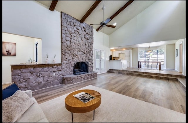 5016 Kemble St, Fort Worth, TX 76103 - living area with high vaulted ceiling, wood finished floors, a ceiling fan, beam ceiling, and a fireplace