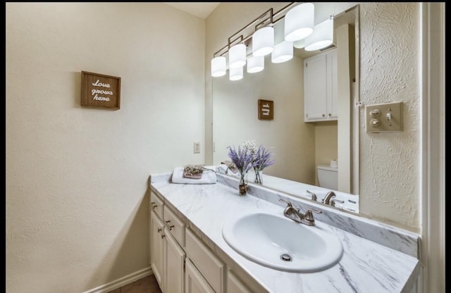 5016 Kemble St, Fort Worth, TX 76103 - bathroom featuring vanity and a textured wall