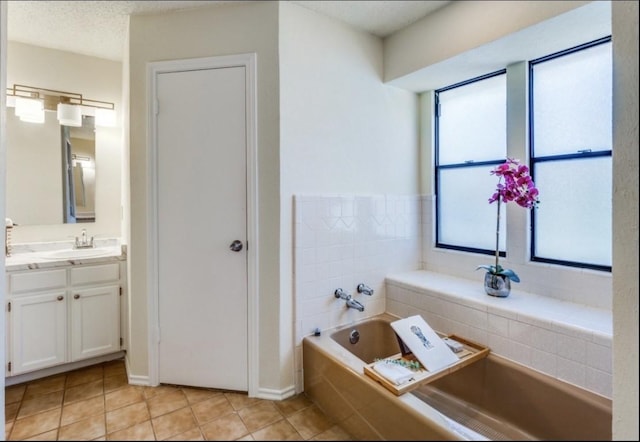 5016 Kemble St, Fort Worth, TX 76103 - bathroom featuring vanity, a garden tub, and tile patterned floors