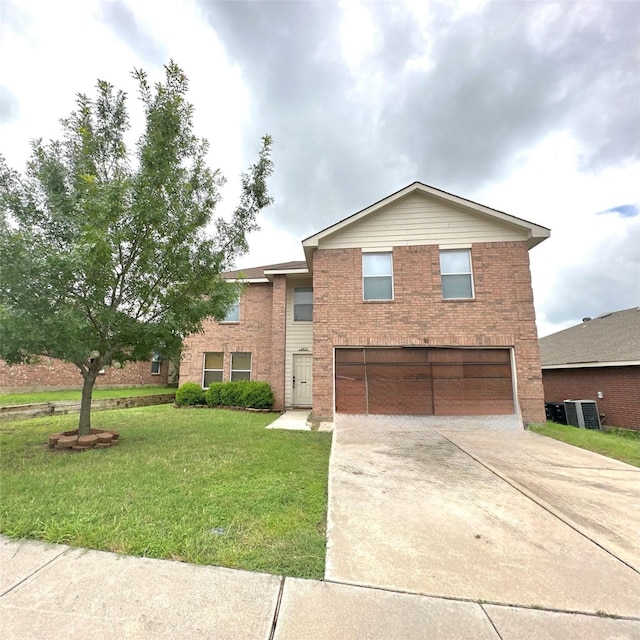 4921 Parkrise Dr, Fort Worth, TX 76179 - traditional home featuring a garage, concrete driveway, brick siding, and a front lawn