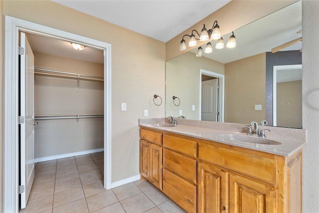 875 Cr221, Stephenville, TX 76401 - full bathroom featuring tile patterned flooring, double vanity, and a spacious closet