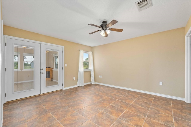 875 Cr221, Stephenville, TX 76401 - unfurnished room with french doors and a ceiling fan