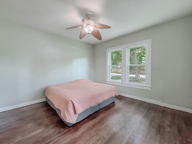 408 S Throckmorton Ave, Kerens, TX 75144 - bedroom with wood finished floors and ceiling fan