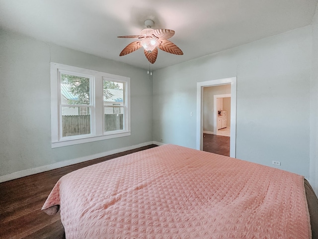 408 S Throckmorton Ave, Kerens, TX 75144 - bedroom with ceiling fan and dark wood-style floors