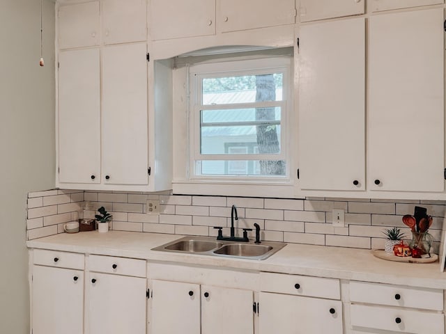 408 S Throckmorton Ave, Kerens, TX 75144 - kitchen featuring light countertops, white cabinets, and tasteful backsplash