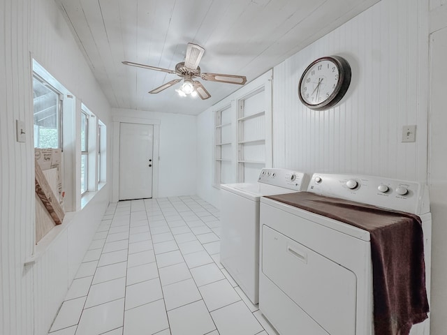 408 S Throckmorton Ave, Kerens, TX 75144 - laundry room featuring washer and clothes dryer, ceiling fan, light tile patterned flooring, and wood walls