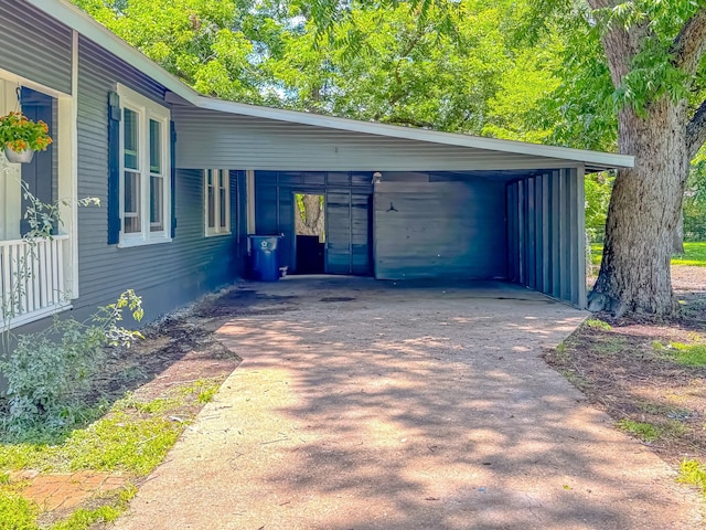 408 S Throckmorton Ave, Kerens, TX 75144 - view of property exterior featuring driveway and a carport