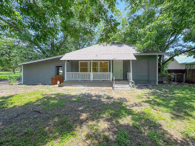 408 S Throckmorton Ave, Kerens, TX 75144 - view of front of house featuring covered porch and a shingled roof