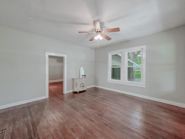 408 S Throckmorton Ave, Kerens, TX 75144 - unfurnished room featuring healthy amount of natural light, wood finished floors, and ceiling fan