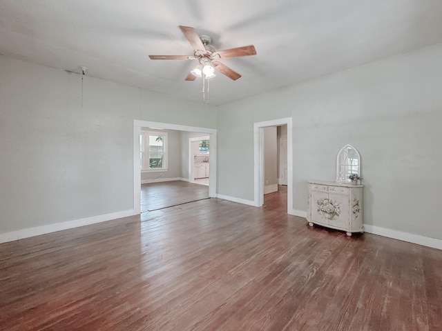 408 S Throckmorton Ave, Kerens, TX 75144 - empty room with a ceiling fan and wood finished floors