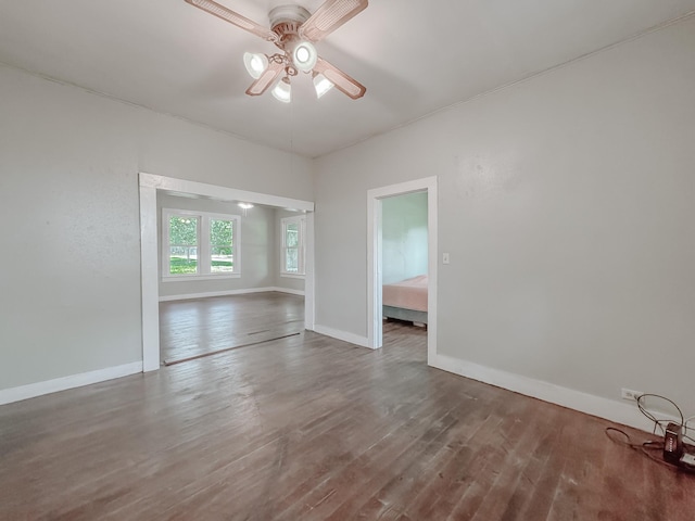 408 S Throckmorton Ave, Kerens, TX 75144 - unfurnished room with a ceiling fan and wood finished floors