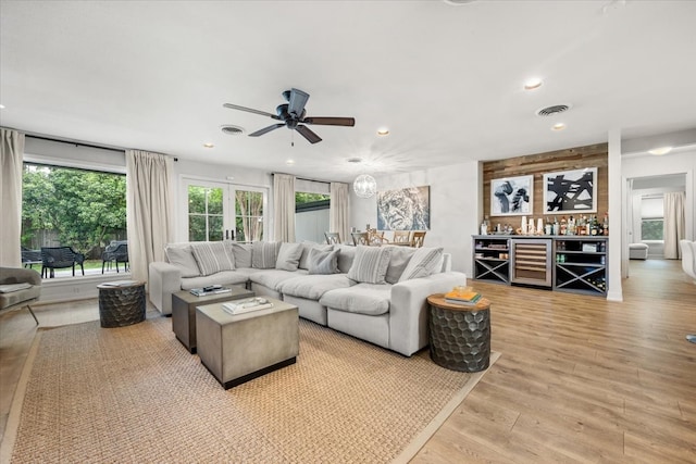 3121 Benbrook Blvd, Fort Worth, TX 76109 - living room featuring beverage cooler, a ceiling fan, light wood finished floors, and recessed lighting