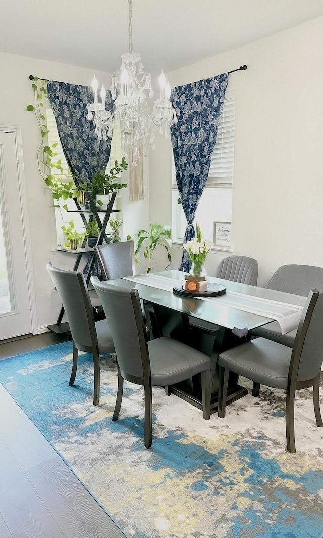 3316 Azure Ln, Celina, TX 75009 - dining space featuring a chandelier and wood finished floors
