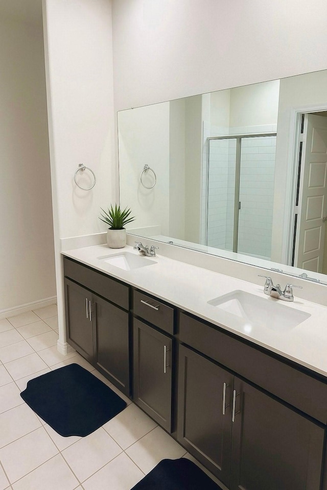 3316 Azure Ln, Celina, TX 75009 - bathroom with double vanity, tile patterned flooring, and a stall shower