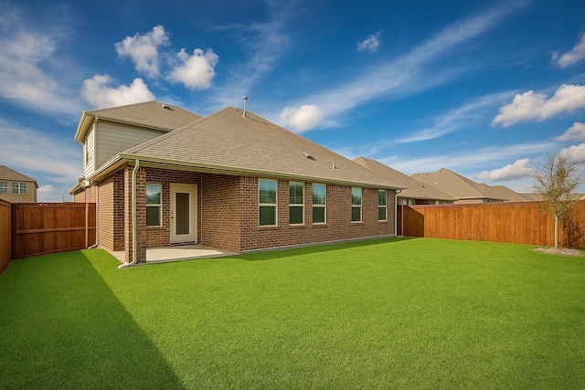 3316 Azure Ln, Celina, TX 75009 - back of house featuring brick siding, a fenced backyard, a patio, and a shingled roof
