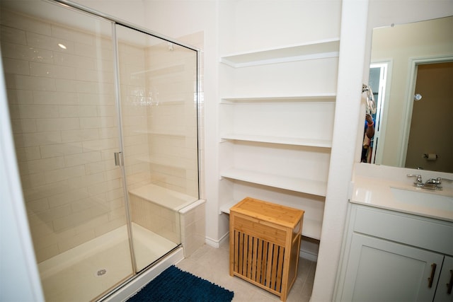 6428 Wales St, Celina, TX 76227 - bathroom with a shower stall, tile patterned floors, vanity, and a spacious closet