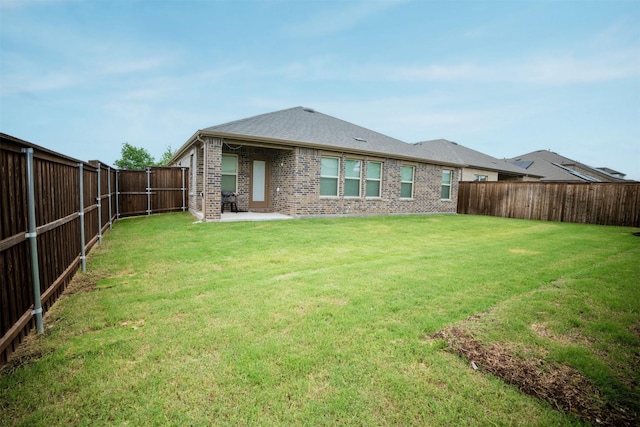 6428 Wales St, Celina, TX 76227 - back of property featuring brick siding, a fenced backyard, and a patio area
