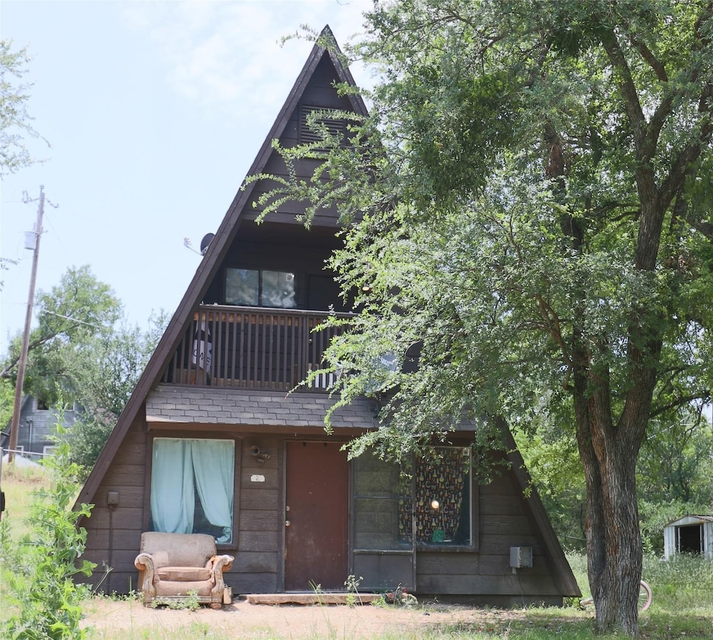 120 Jenny Ln, Weatherford, TX 76085 - rear view of house with a balcony