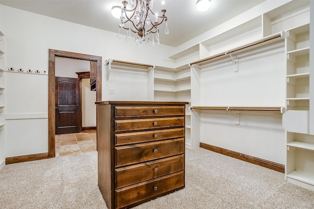 1023 Winding Creek Dr, Kennedale, TX 76060 - walk in closet with carpet flooring and a chandelier