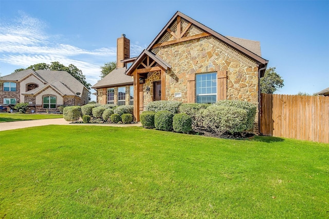 1023 Winding Creek Dr, Kennedale, TX 76060 - view of front of home featuring stone siding and a chimney