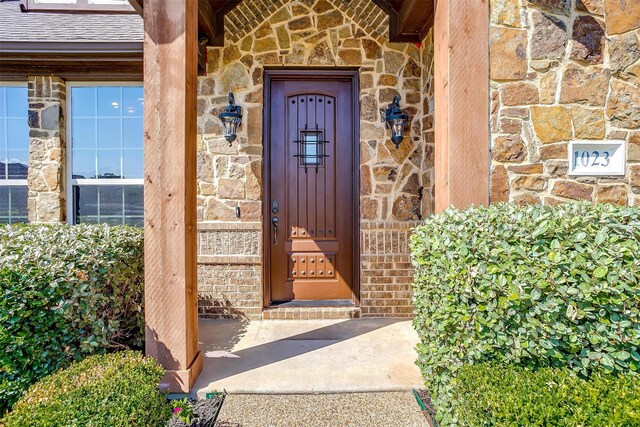 1023 Winding Creek Dr, Kennedale, TX 76060 - property entrance featuring stone siding