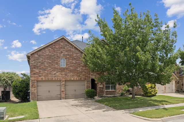 326 Blackhaw Dr, Fate, TX 75087 - view of front of house featuring brick siding, a garage, driveway, and a front yard