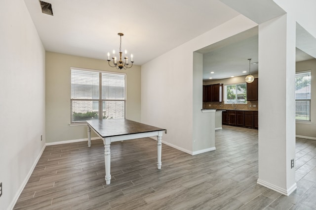 326 Blackhaw Dr, Fate, TX 75087 - unfurnished dining area featuring light wood-style flooring, a chandelier, and recessed lighting