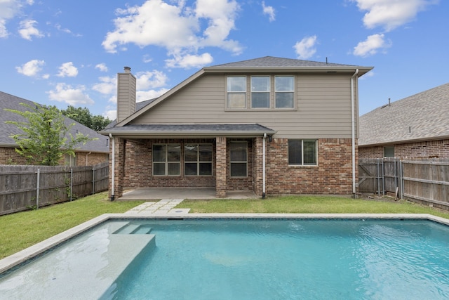 326 Blackhaw Dr, Fate, TX 75087 - back of house with a patio, a fenced backyard, brick siding, and a chimney