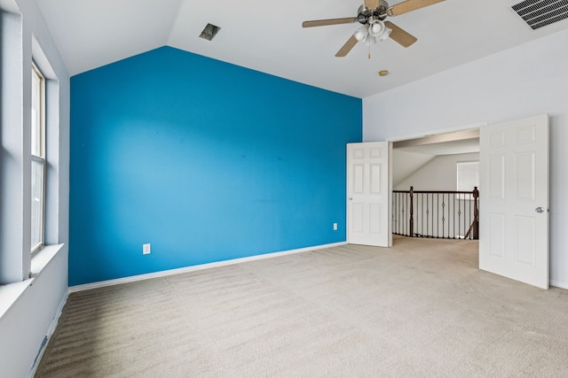 326 Blackhaw Dr, Fate, TX 75087 - spare room featuring a ceiling fan, carpet flooring, vaulted ceiling, and healthy amount of natural light
