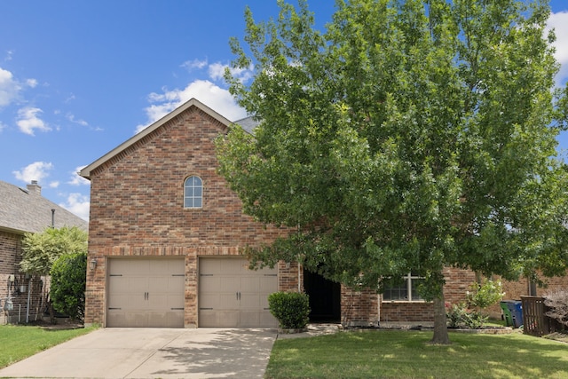 326 Blackhaw Dr, Fate, TX 75087 - view of front of property featuring brick siding, an attached garage, driveway, and a front lawn