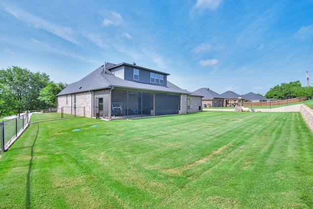 10107 Ravenswood Rd, Granbury, TX 76049 - rear view of house featuring a sunroom, a fenced backyard, and brick siding