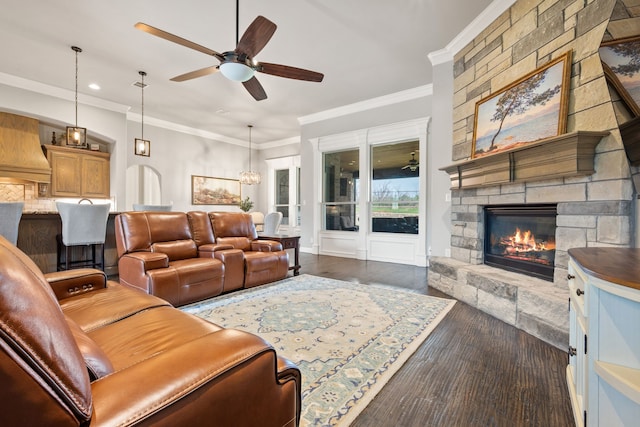 10107 Ravenswood Rd, Granbury, TX 76049 - living area with a ceiling fan, a stone fireplace, recessed lighting, dark wood-type flooring, and ornamental molding