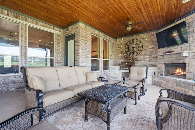 10107 Ravenswood Rd, Granbury, TX 76049 - view of patio with an outdoor living space with a fireplace, ceiling fan, and an outdoor kitchen