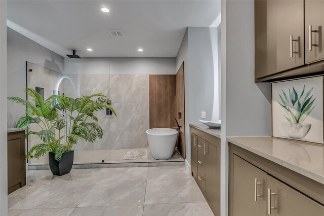 3449 W T Parr Rd W, Grapevine, TX 76051 - full bath with a walk in shower, a freestanding bath, vanity, marble finish flooring, and recessed lighting